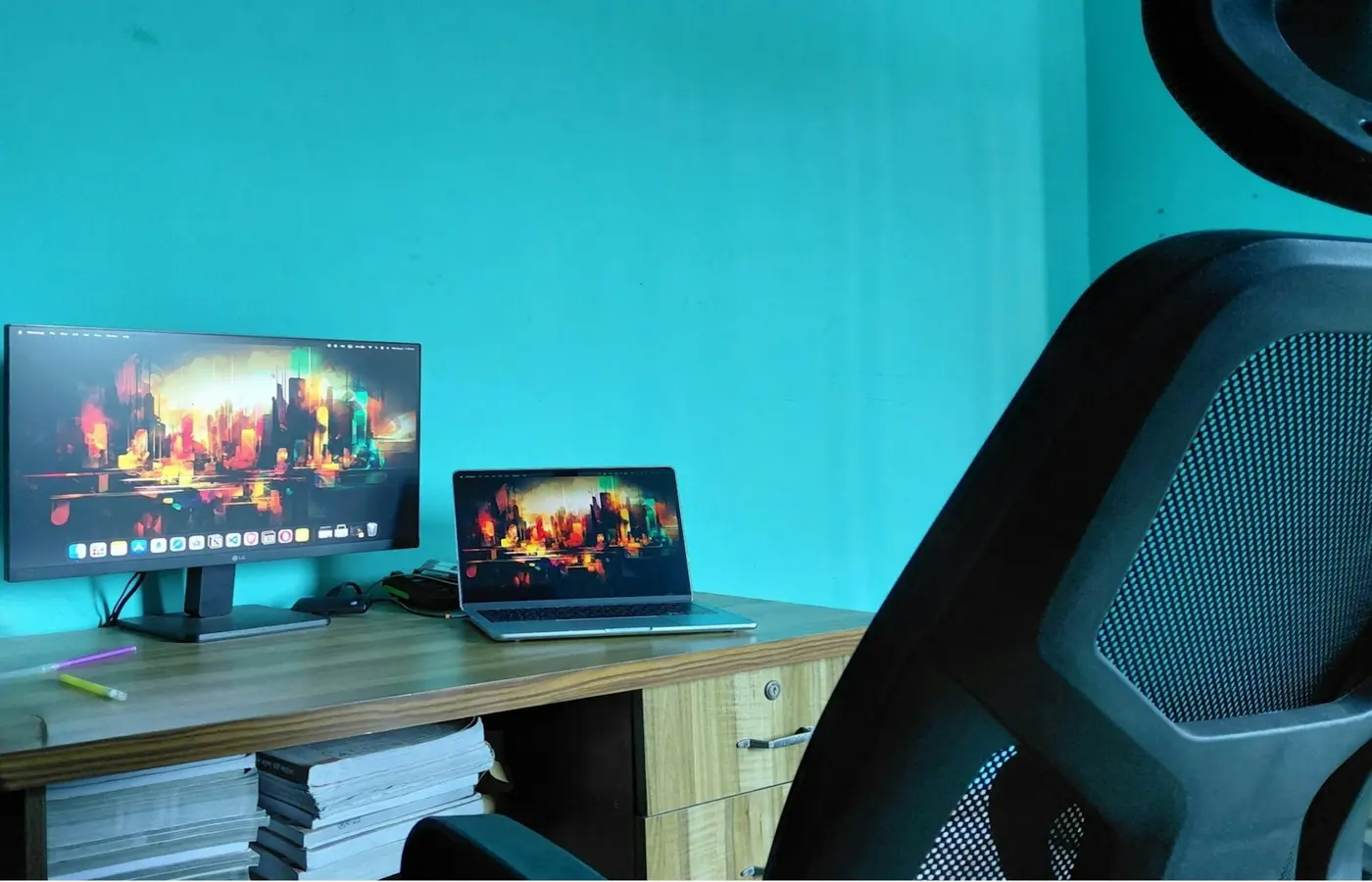 Programmer laptop setup with dual external monitors on a desk